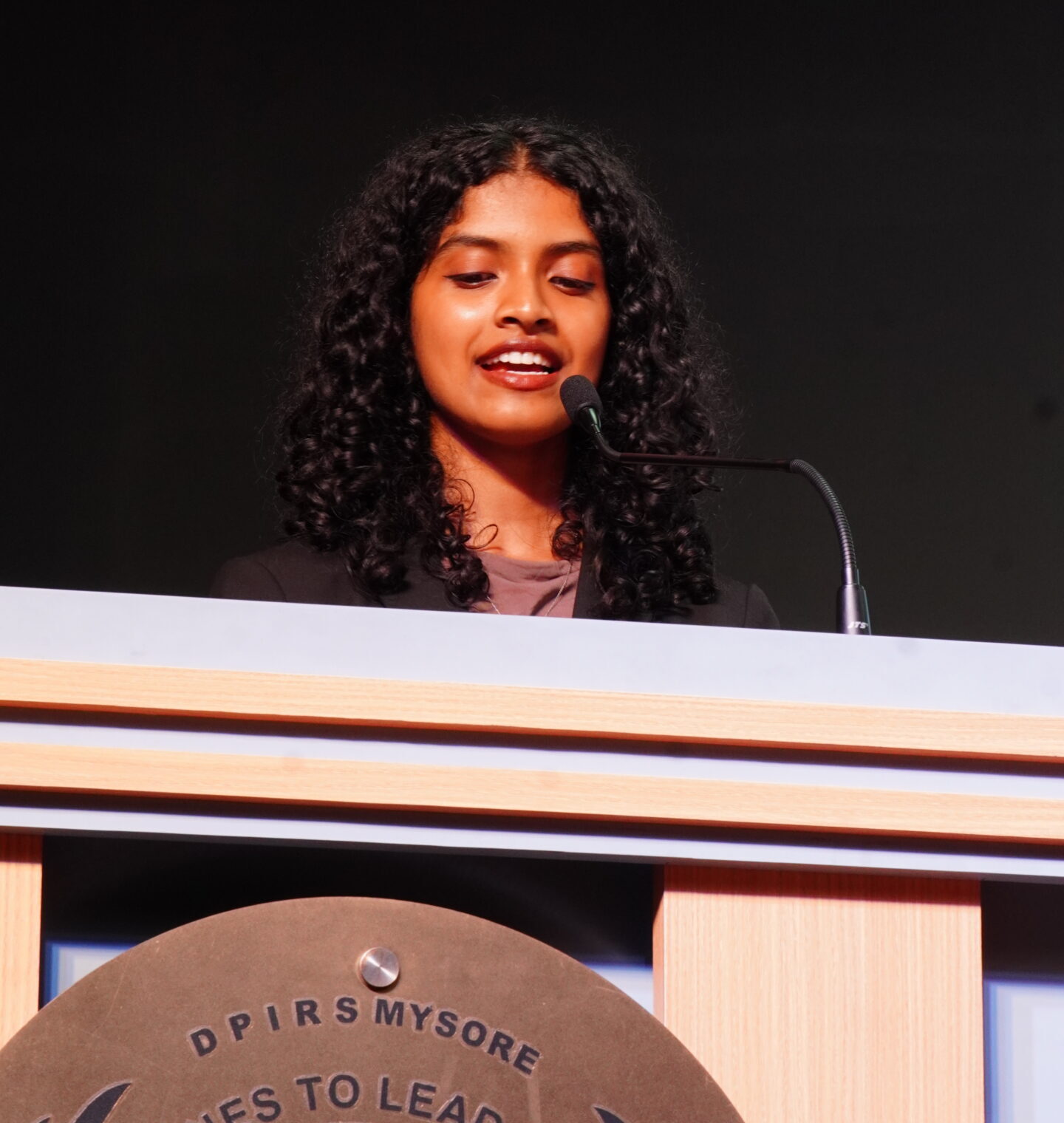 A student delivering a speech during Investiture Ceremony 2026 at DPIRS, expressing gratitude and the importance of leadership and responsibility.