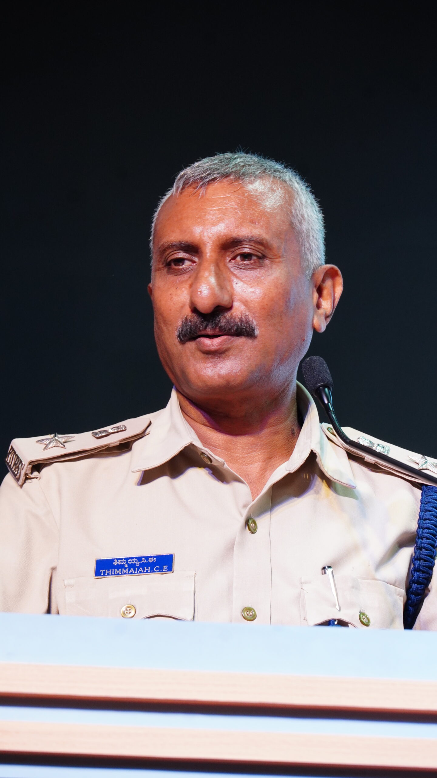 Chief Guest Sri. C. E. Thimmaiah, Additional Superintendent of Police, Mandya District, Karnataka, delivering his address during Investiture Ceremony 2026 at DPIRS.