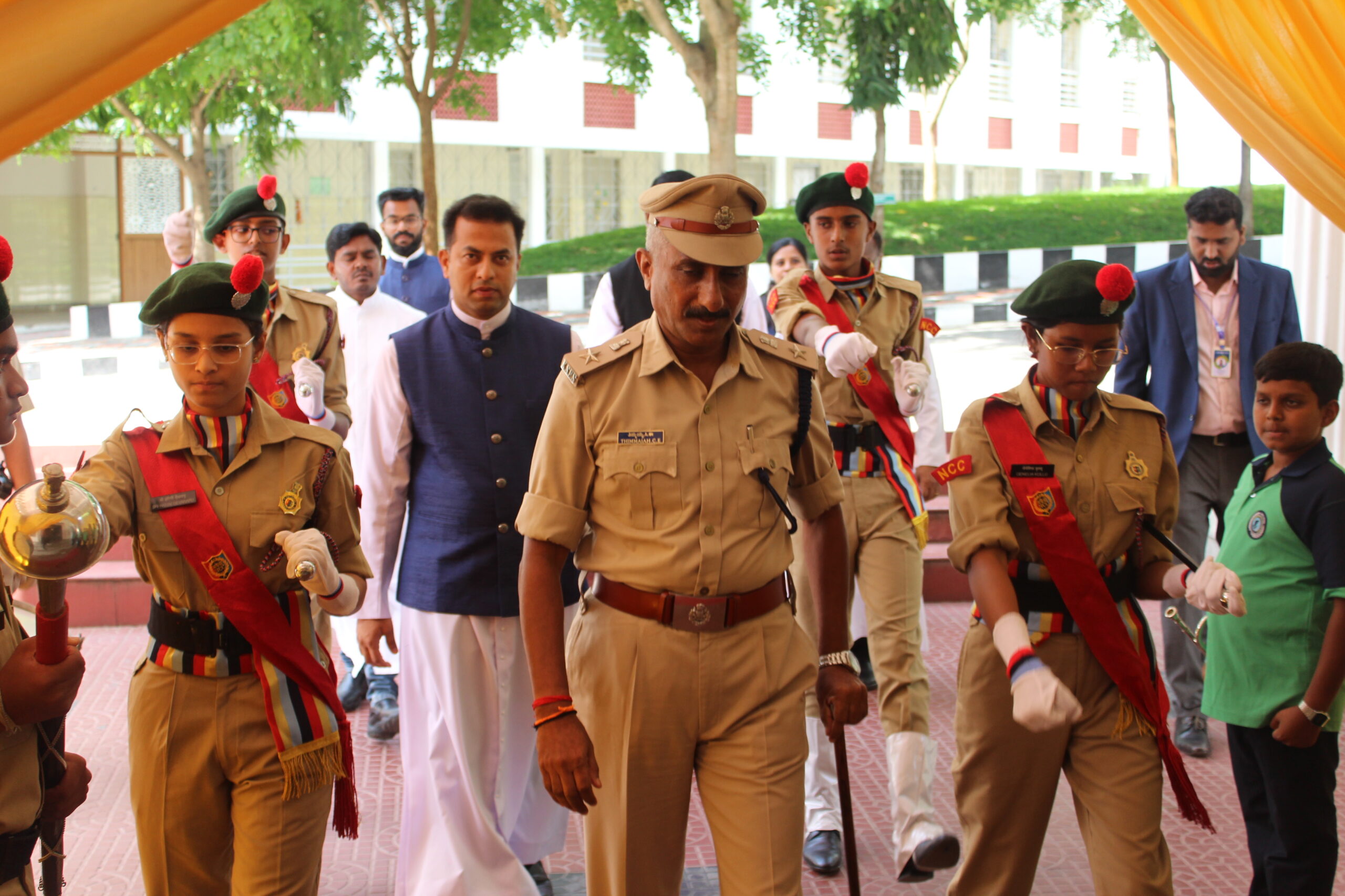 Faculty members and students warmly welcoming Chief Guest Sri. C. E. Thimmaiah during Investiture Ceremony 2026 at DPIRS.