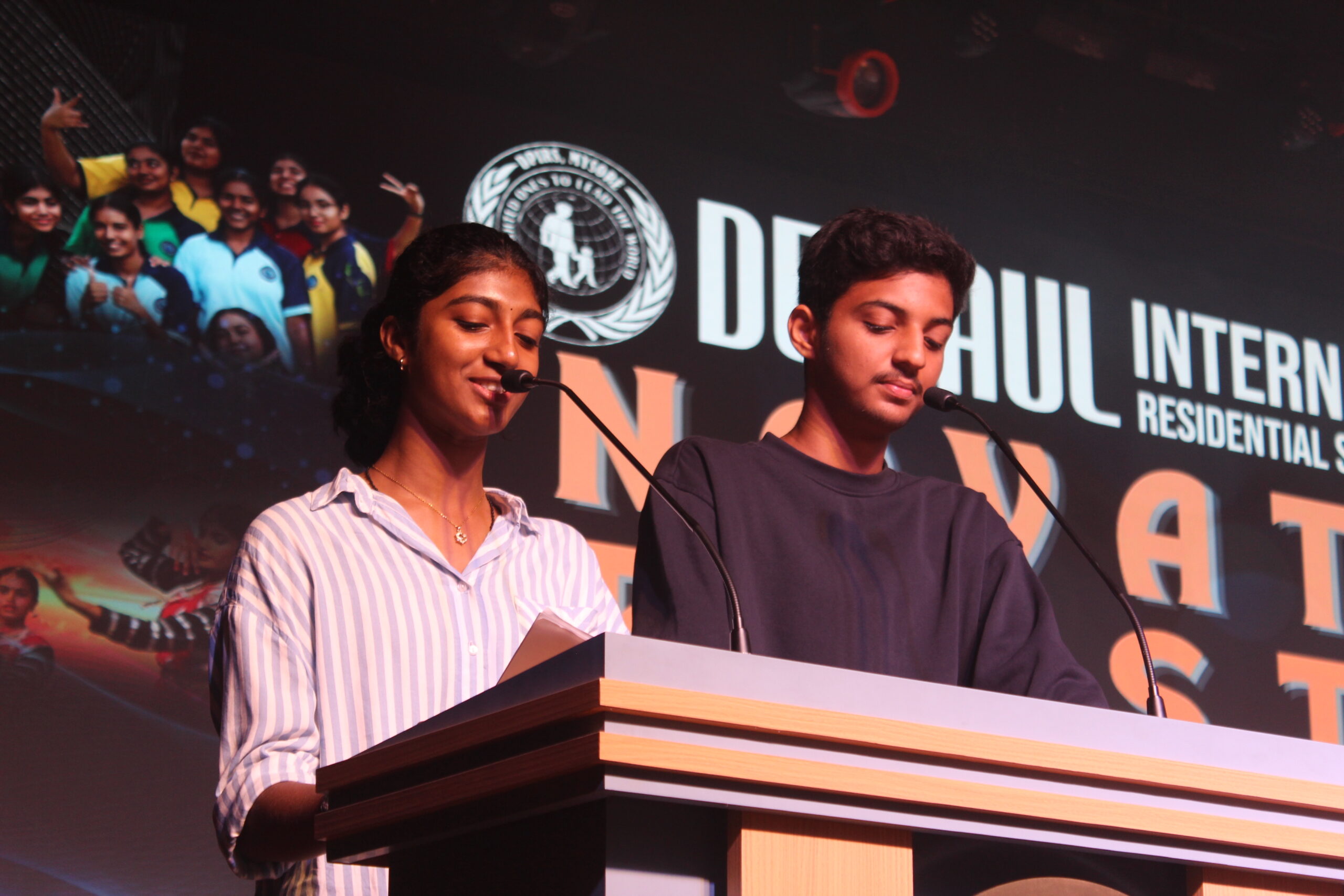 Students and staff performing during Novato Fiesta 2K25 Freshers' Day celebration at De Paul International Residential School, Mysuru.